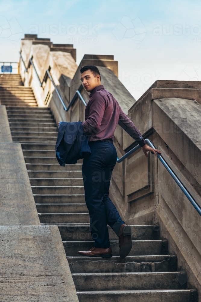 young man on stairs - Australian Stock Image