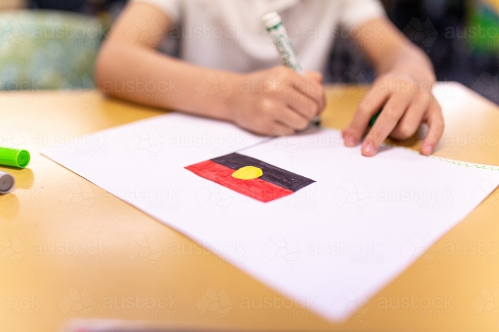 Young Student Drawing Aboriginal Flag - Australian Stock Image