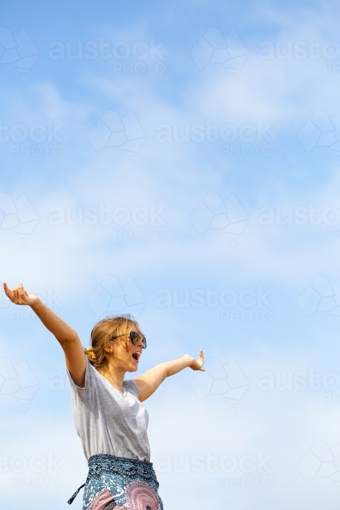 Young woman against sky background - Australian Stock Image