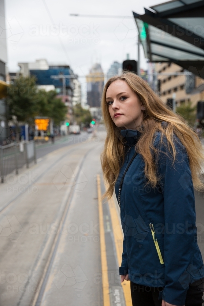 Young Woman Waiting for the Tram - Australian Stock Image