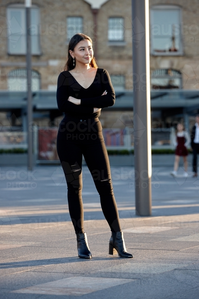 Young woman wearing leather jacket - Australian Stock Image