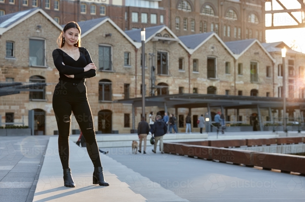 Young woman wearing leather jacket - Australian Stock Image