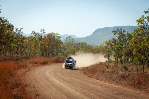 4 x 4 driving on dusty gravel road - Australian Stock Image