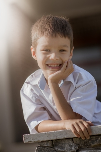6 year old mixed race boy leaves home for his first day of school - Australian Stock Image