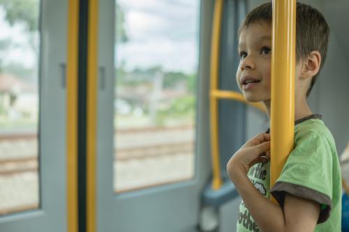 6 year old mixed race boy rides on a Sydney city train