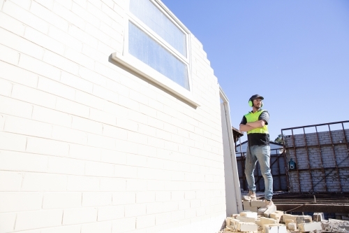 A builder working at height on on construction - Australian Stock Image