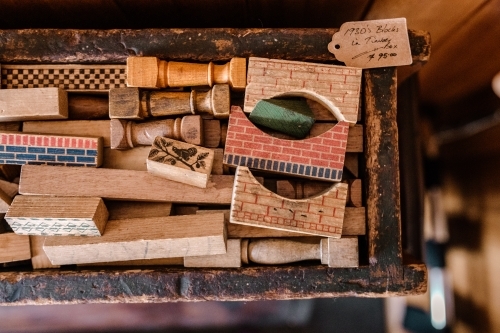 A collection of various wooden rubber stamps with different patterns and designs. - Australian Stock Image