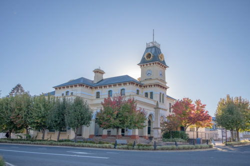 A country post office with autumn colours under a soft blue sky - Australian Stock Image