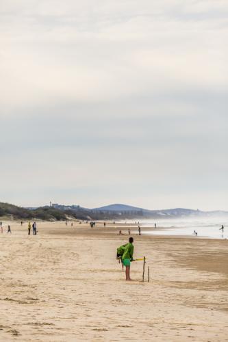 A game of beach cricket. - Australian Stock Image