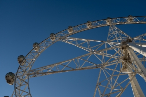 A generic large ferris wheel with gondolas to enjoy the view - Australian Stock Image