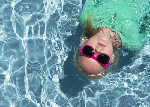 A Girl Floating in Water from above - Australian Stock Image