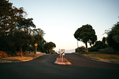 A keep left sign on a residential street - Australian Stock Image