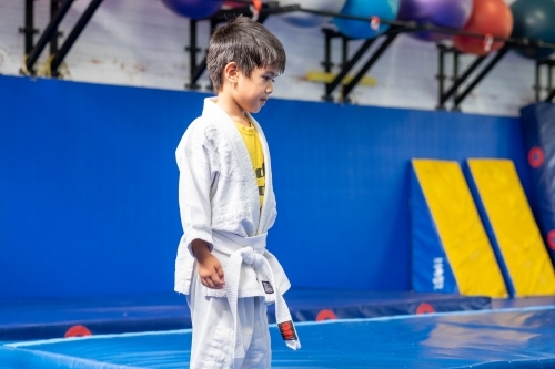 a kid participating in a judo session - Australian Stock Image