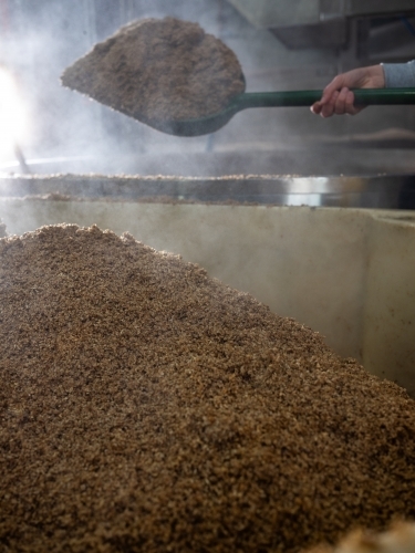 A large container being filled with grain - Australian Stock Image