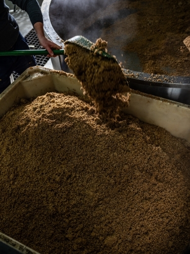 A large container being filled with grain - Australian Stock Image