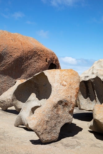 A large rock formation on the australian coastline under blue sky - Australian Stock Image