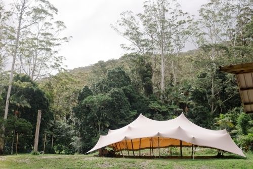 A large white tent in the forest. - Australian Stock Image