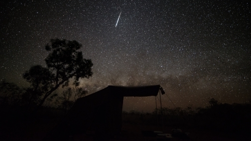 A night sky filled with stars and meteor streak. - Australian Stock Image