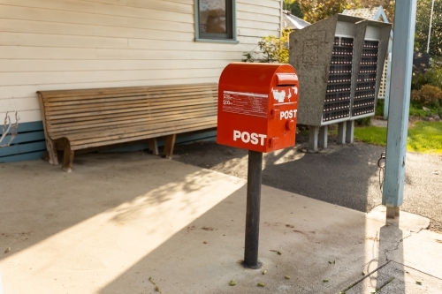 A red australia post letter box stripped of all branding and logos. - Australian Stock Image