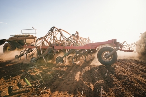 A seeding machine dry sowing wheat in the Avon Valley region of Western Australia - Australian Stock Image