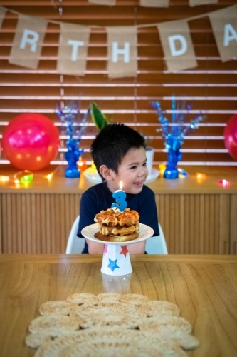 A simple but sweet waffle stack for the shy birthday boy - Australian Stock Image