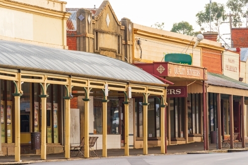 A streetscape of historic shop fronts with wide verandas - Australian Stock Image