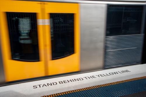 A train moving along the platform - Australian Stock Image