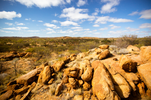 A view towards the West Macdonnell Ranges from near the Old Telegraph Station in Alice Springs - Australian Stock Image