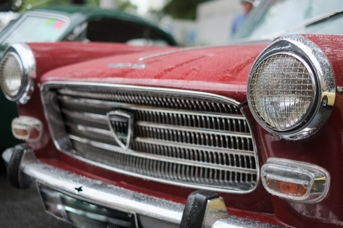 a vintage car headlights and grills on display - Australian Stock Image