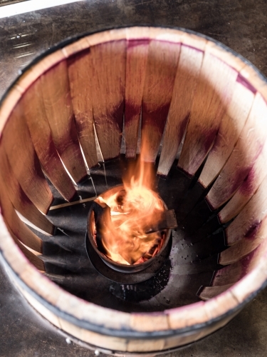 A whisky barrel being charred for storage - Australian Stock Image