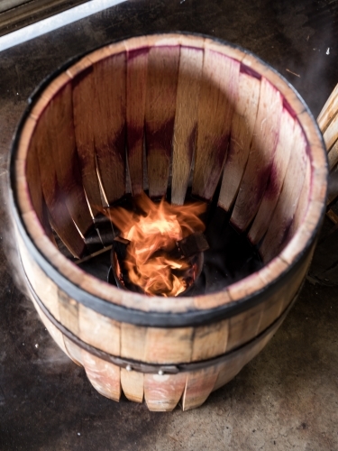 A whisky barrel being charred for storage - Australian Stock Image