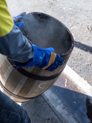 A whisky barrel being charred for storage - Australian Stock Image