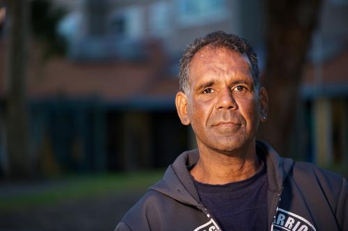 Aboriginal Australian Man wearing a black hoodie - Australian Stock Image