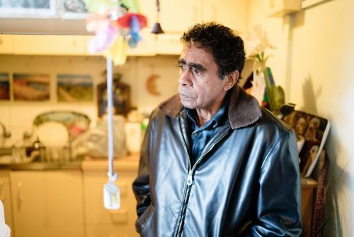 Aboriginal Elder in a Residential Kitchen - Australian Stock Image