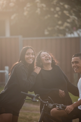 Aboriginal family laughing in backyard