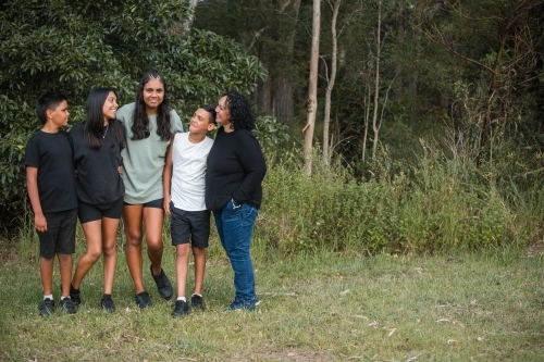 Aboriginal family portrait outdoors - Australian Stock Image