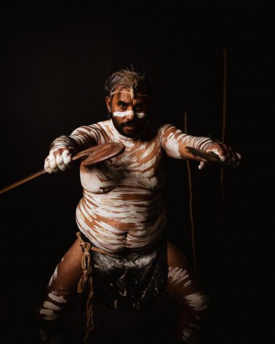 Aboriginal male holding boomerangs - Australian Stock Image