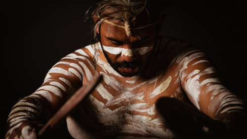 Aboriginal Male looking down - Australian Stock Image