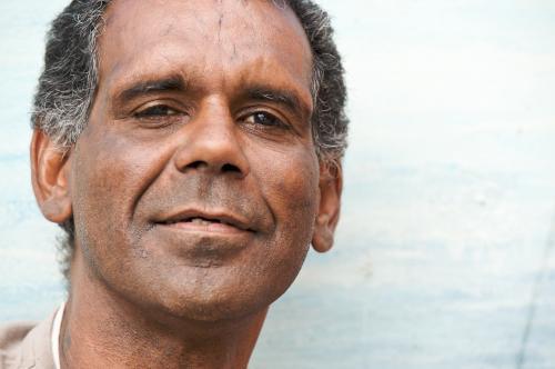 Aboriginal Man Looking at Camera with a Half Smile