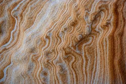 Abstract pattern of iron staining in Sydney sandstone - Australian Stock Image