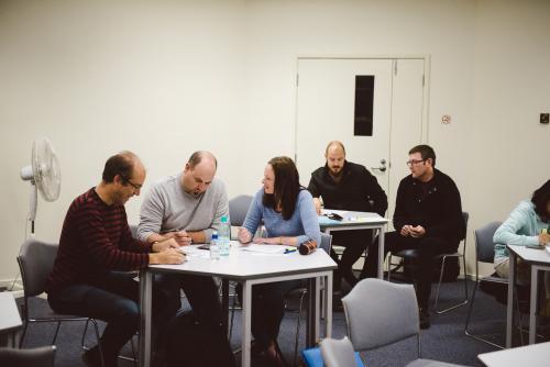 Adult students at a small group tutorial at university