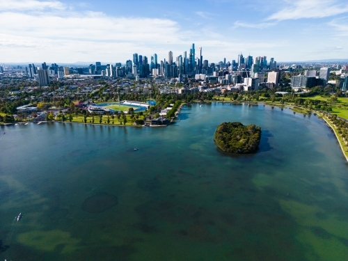 Aerial image above Albert Park Lake looking towards the Melbourne city centre - Australian Stock Image