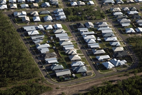 Aerial image of new housing development bordering bushland - Australian Stock Image