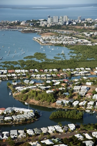Aerial image of waterfront housing with city and harbour in the background - Australian Stock Image