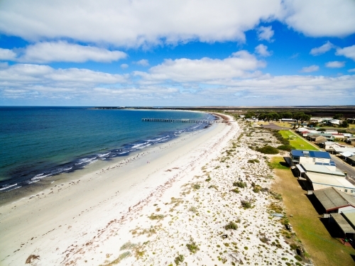 Aerial of seaside shacks and beach - Australian Stock Image