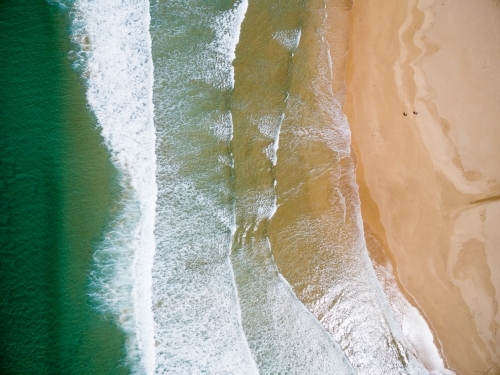 aerial of surf  and people on sandy beach - Australian Stock Image