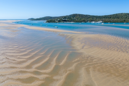 Aerial panorama of estuary, sandbars, and yachts at the Town of 1770, QLD. - Australian Stock Image