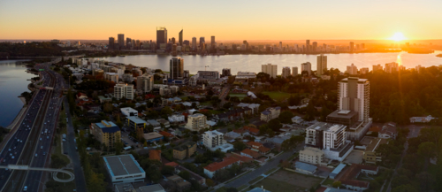 Aerial panorama of South Perth and Perth City skyline as the sun rises on the horizon - Australian Stock Image