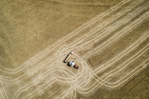 Aerial photo of filling a truck at harvest in the Wheatbelt of Western Australia - Australian Stock Image