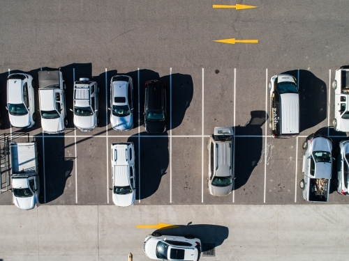 Aerial shot of cars parked in carpark with empty spaces - Australian Stock Image